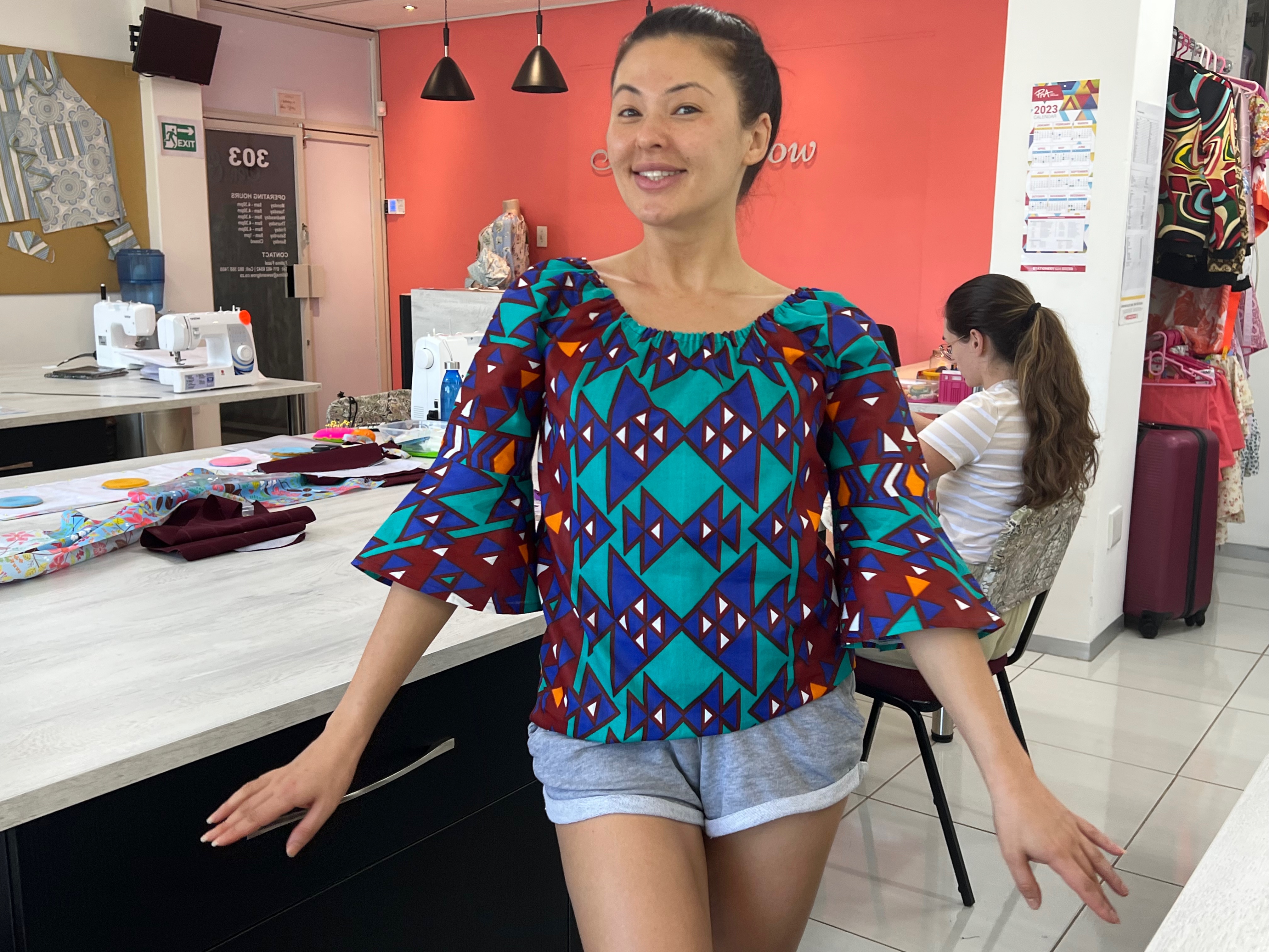 Student wearing a blouse she made