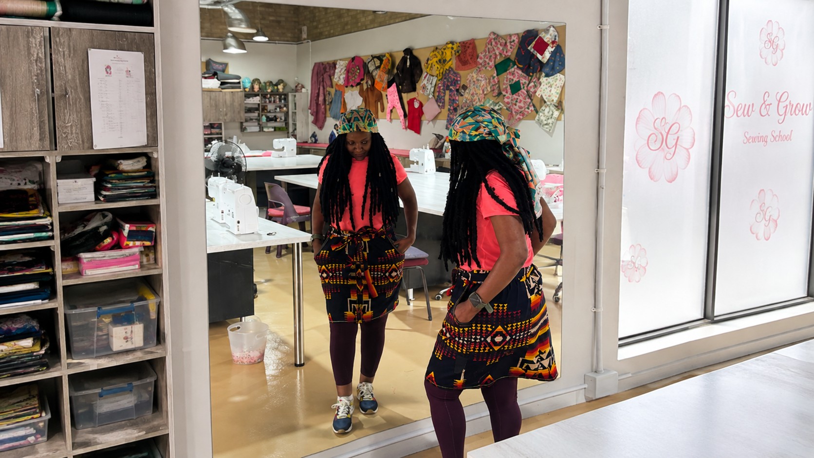 A student's own finished garment on a dress form in the studio