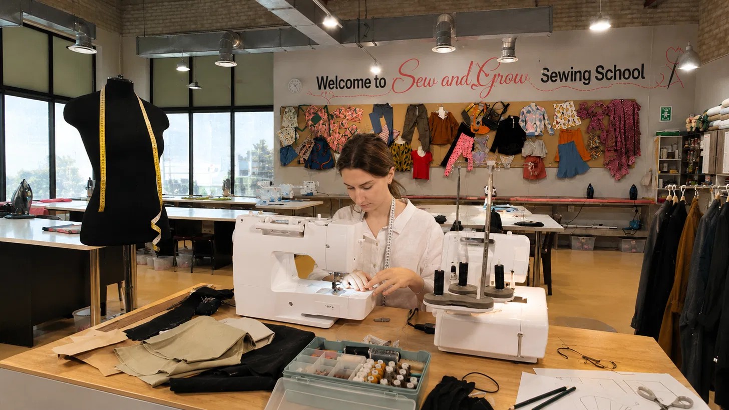 A graduate sewing for their own clothing label
